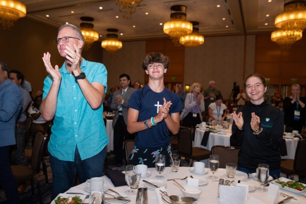 People standing to applaud awardees