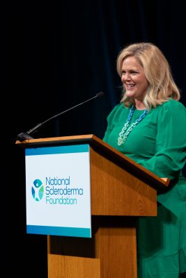 Mary Wheatley speaking at the podium