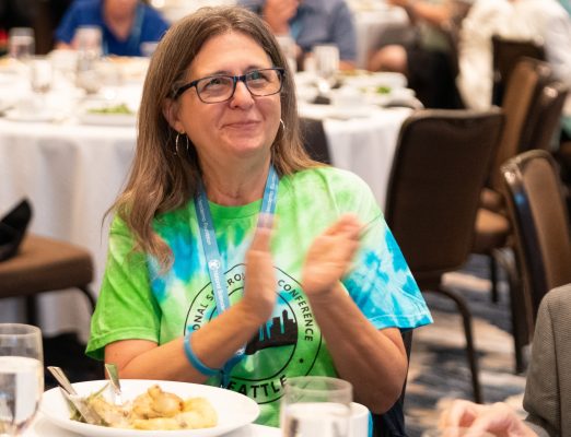 Member of audience applauds award winner