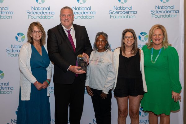 Upper Great Lakes Chapter leaders with Mary Wheatley standing for posed photo.